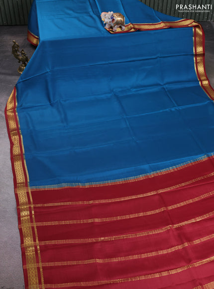 Pure mysore silk saree cs blue and rust shade with plain body and zari woven border