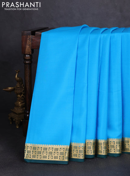 Pure mysore silk saree teal blue and bottle green with plain body and zari woven border