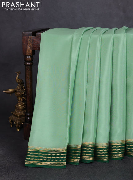 Pure mysore silk saree pista green and bottle green with plain body and zari woven border
