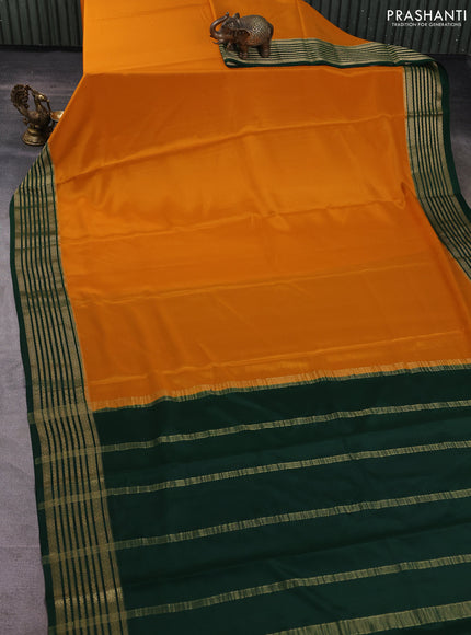 Pure mysore silk saree dark mustard and bottle green with plain body and zari woven border