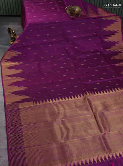 Pure soft silk saree dark magenta pink with allover zari woven buttas and temple design zari woven border