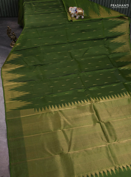 Pure soft silk saree mehendi green with allover zari woven buttas and temple design zari woven border