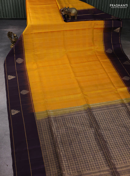 Pure soft silk saree mango yellow and purple with allover zari woven checked pattern and long zari woven border