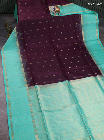 Pure soft silk saree wine shade and teal green with allover zari woven buttas and long zari woven checked butta border