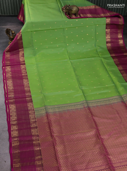 Pure soft silk saree green and dark magenta pink with allover zari woven buttas and zari woven border