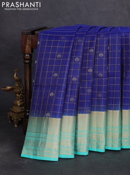 Pure soft silk saree blue and teal blue with allover zari checks & buttas and long zari woven border