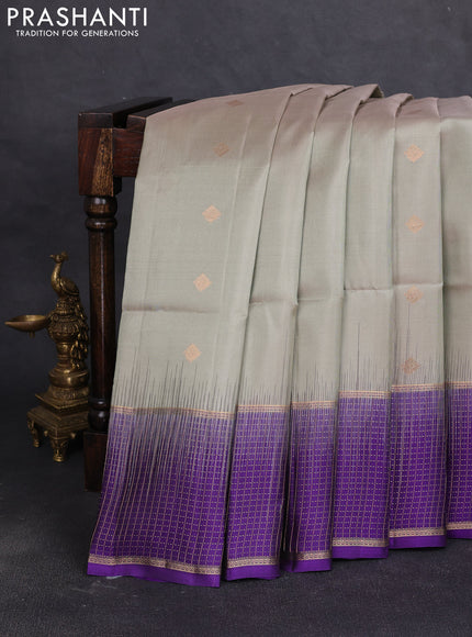 Pure soft silk saree elaich igreen and violet with zari woven buttas and long zari woven checked border