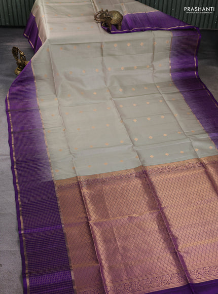 Pure soft silk saree elaich igreen and violet with zari woven buttas and long zari woven checked border