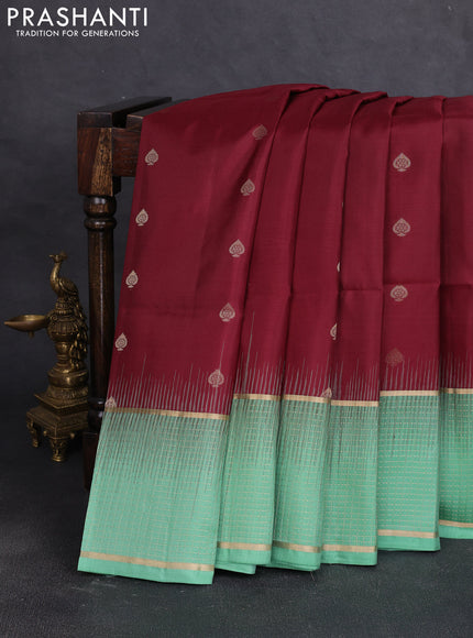 Pure soft silk saree maroon and teal green shade with allover zari woven buttas and long zari woven checked border