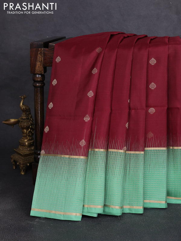Pure soft silk saree maroon and teal green shade with allover zari woven buttas and long zari woven checked border