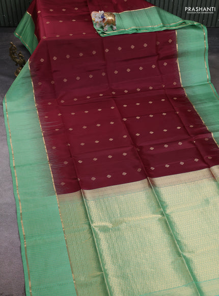Pure soft silk saree maroon and teal green shade with allover zari woven buttas and long zari woven checked border