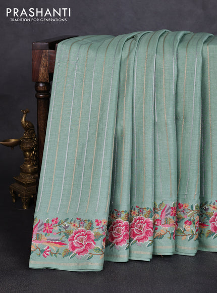 Semi tussar saree pastel green with allover silver & zari stripe pattern and convent embroidery border