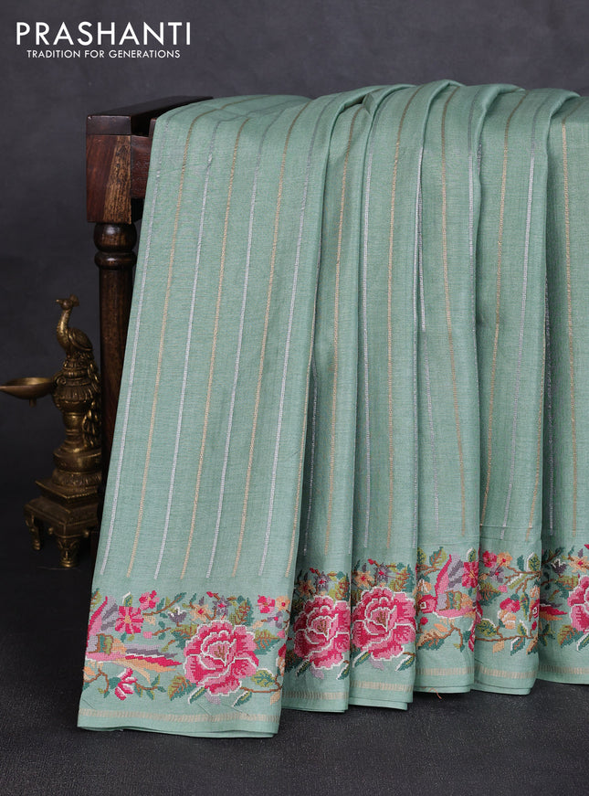 Semi tussar saree pastel green with allover silver & zari stripe pattern and convent embroidery border
