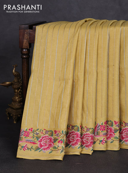 Semi tussar saree pale yellow with allover silver & zari stripe pattern and convent embroidery border