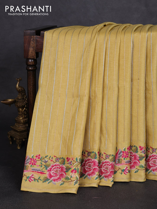 Semi tussar saree pale yellow with allover silver & zari stripe pattern and convent embroidery border