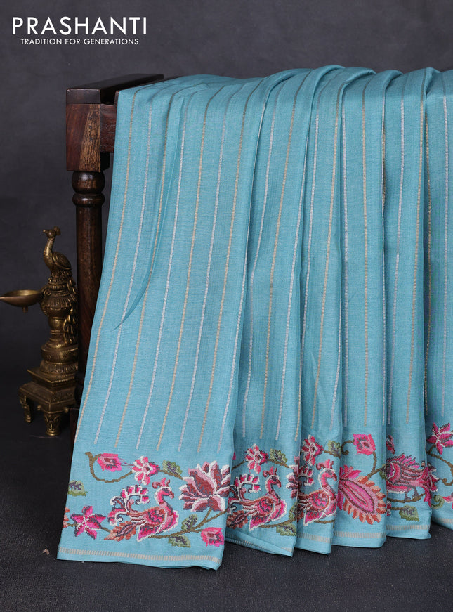 Semi tussar saree teal blue with allover silver & zari stripe pattern and convent embroidery border