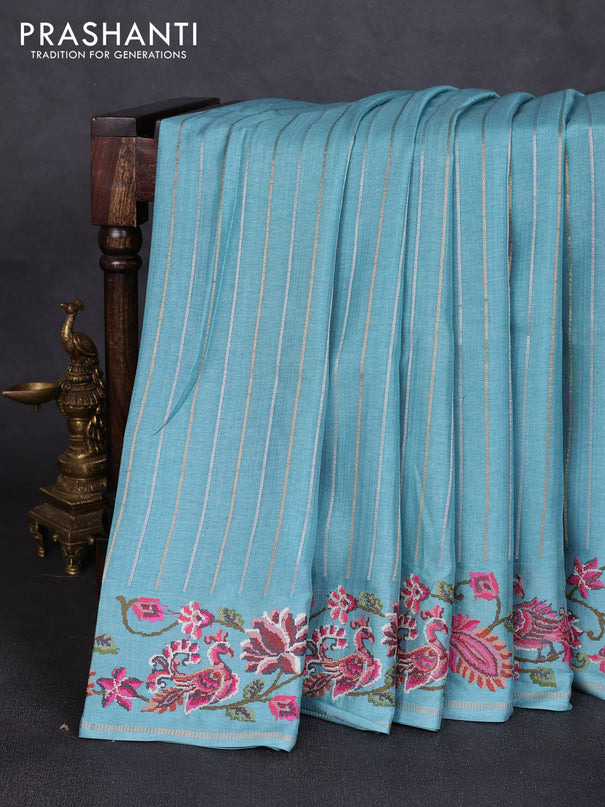 Semi tussar saree teal blue with allover silver & zari stripe pattern and convent embroidery border
