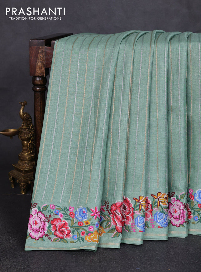 Semi tussar saree pastel green with allover silver & zari stripe pattern and convent embroidery border