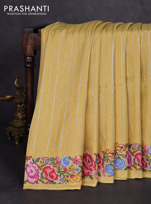Semi tussar saree pale yellow with allover silver & zari stripe pattern and convent embroidery border