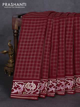 Semi tussar saree deep maroon with allover zari checked pattern and embroidery border