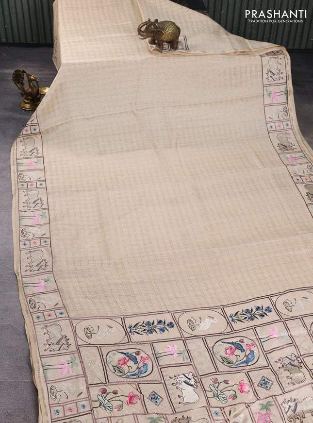 Semi tussar saree beige with allover zari checked pattern and pihwai embroidery border
