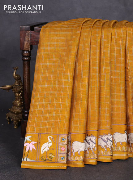 Semi tussar saree mustard yellow with allover zari checked pattern and pihwai embroidery border