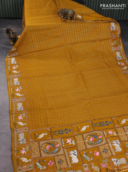 Semi tussar saree mustard yellow with allover zari checked pattern and pihwai embroidery border
