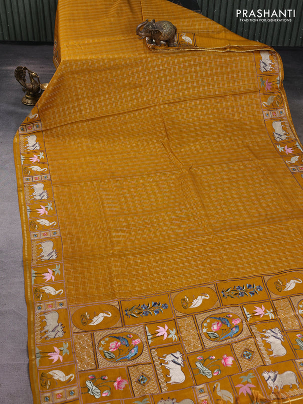 Semi tussar saree mustard yellow with allover zari checked pattern and pihwai embroidery border