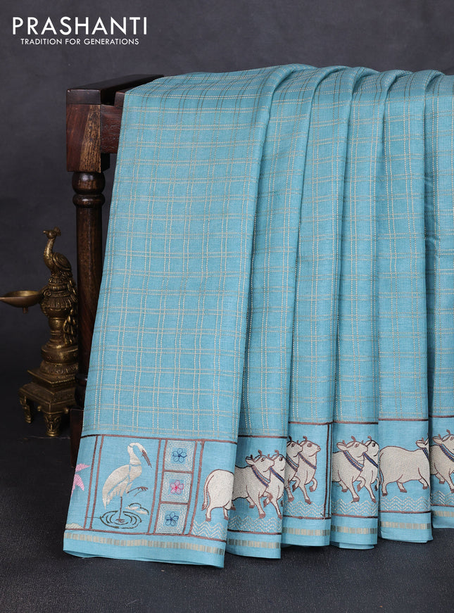 Semi tussar saree pastel blue with allover zari checked pattern and pihwai embroidery border