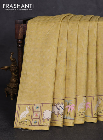 Semi tussar saree pale yellow with allover zari checked pattern and pihwai embroidery border