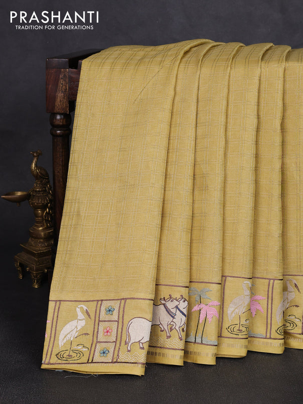 Semi tussar saree pale yellow with allover zari checked pattern and pihwai embroidery border