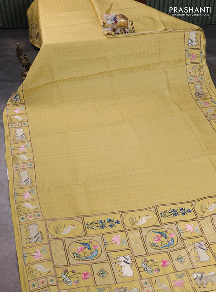 Semi tussar saree pale yellow with allover zari checked pattern and pihwai embroidery border