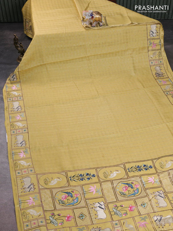 Semi tussar saree pale yellow with allover zari checked pattern and pihwai embroidery border