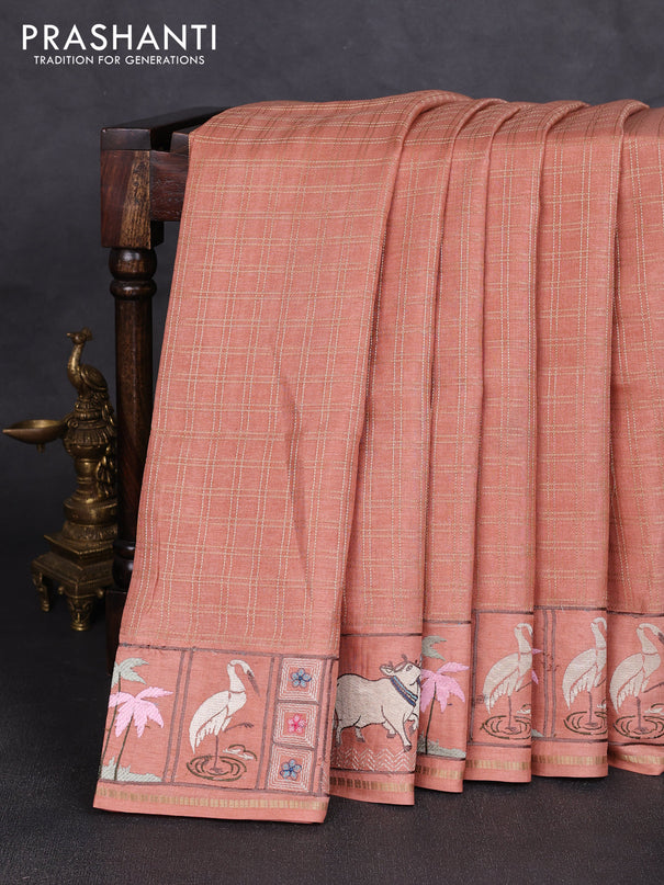 Semi tussar saree peach shade with allover zari checked pattern and pihwai embroidery border