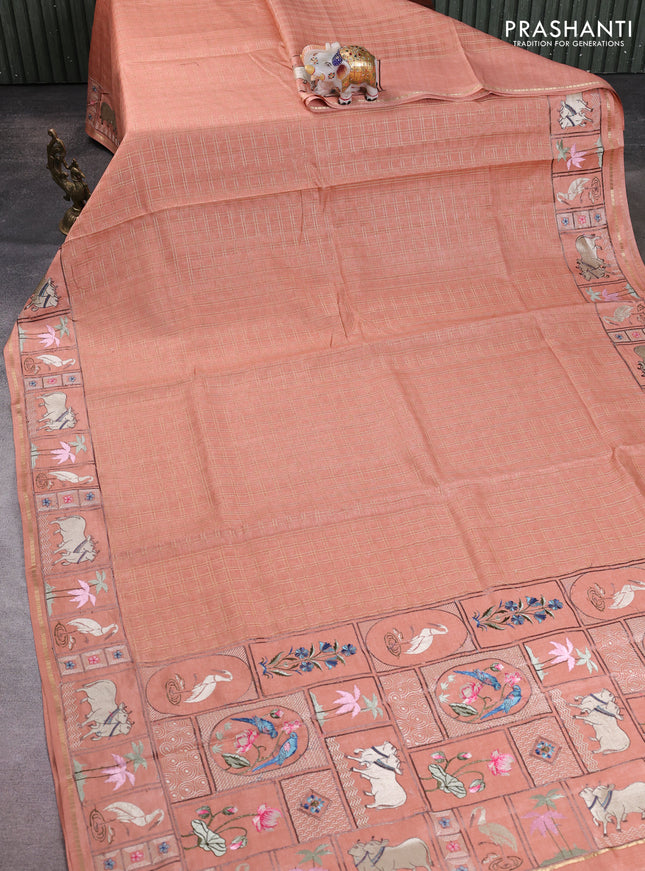Semi tussar saree peach shade with allover zari checked pattern and pihwai embroidery border
