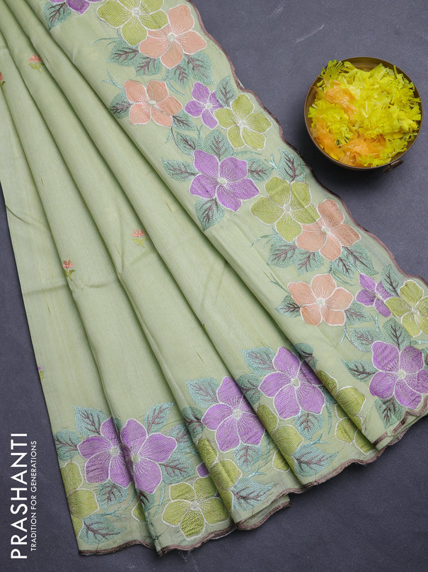 Semi raw silk saree pista green with embroidery buttas and floral embroidery border