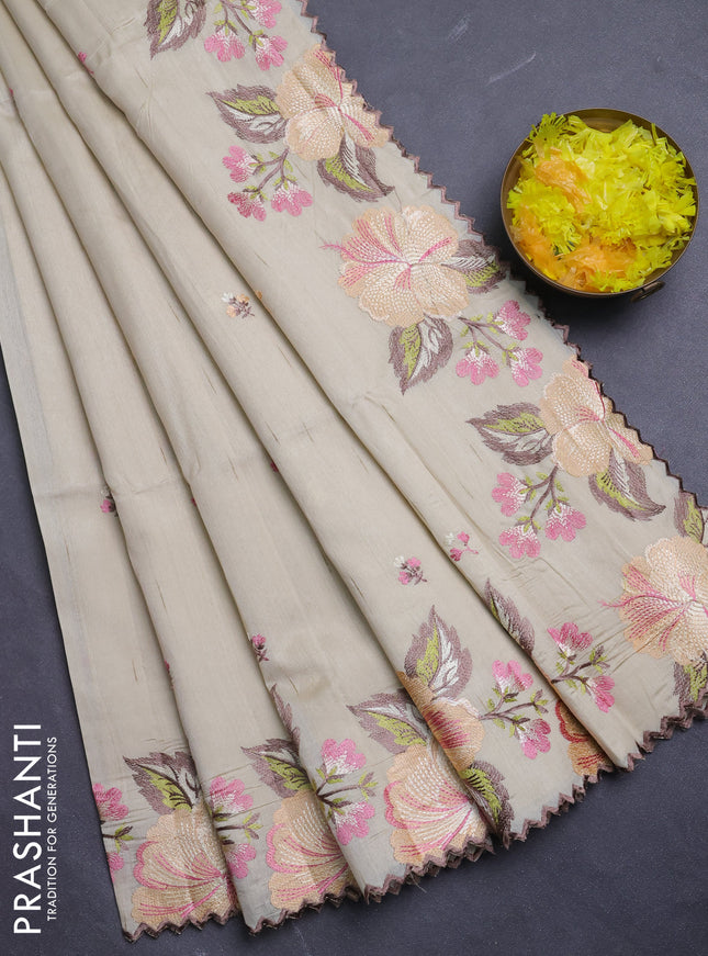 Semi raw silk saree beige with embroidery buttas and floral embroidery border