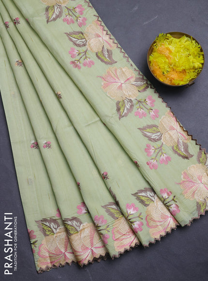 Semi raw silk saree pista green with embroidery buttas and floral embroidery border