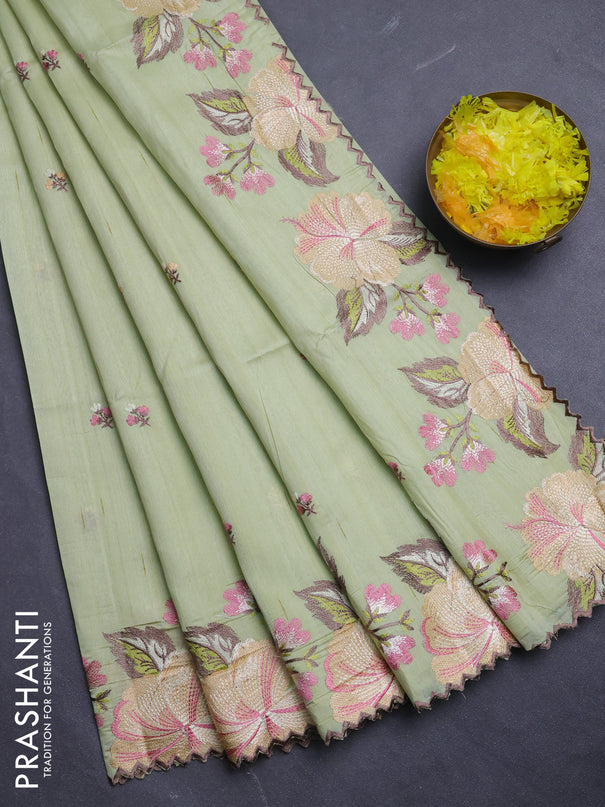Semi raw silk saree pista green with embroidery buttas and floral embroidery border