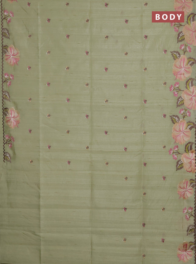 Semi raw silk saree pista green with embroidery buttas and floral embroidery border