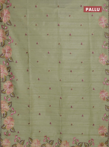 Semi raw silk saree pista green with embroidery buttas and floral embroidery border