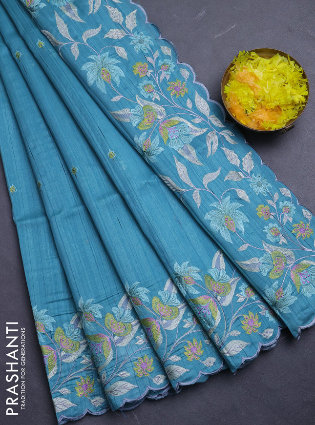 Semi raw silk saree teal blue with embroidery buttas and floral embroidery border