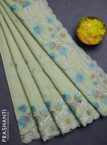 Semi raw silk saree pista green with embroidery buttas and floral embroidery border