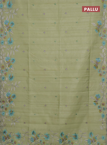 Semi raw silk saree pista green with embroidery buttas and floral embroidery border