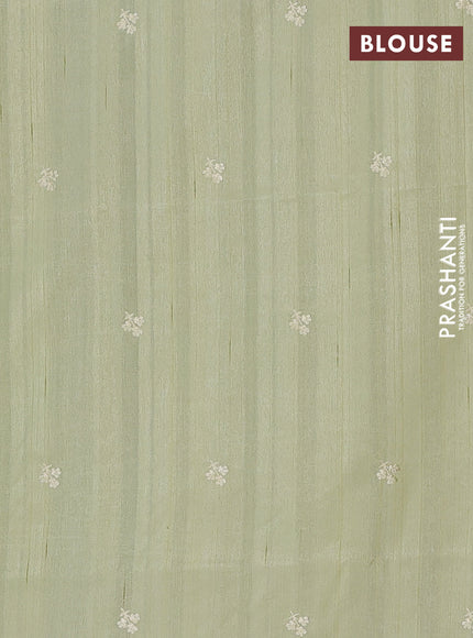 Semi raw silk saree pista green with embroidery buttas and floral embroidery border