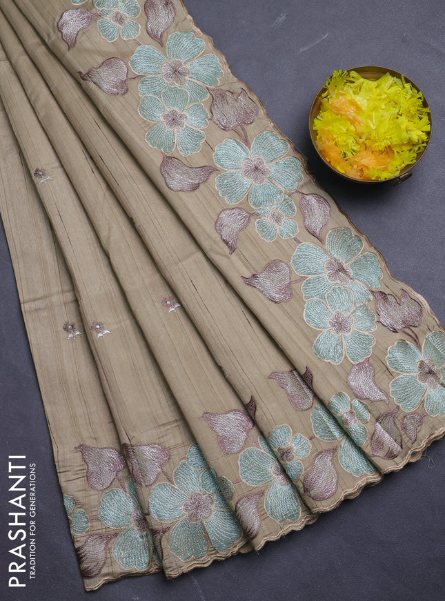 Semi raw silk saree beige with embroidery buttas and floral embroidery border