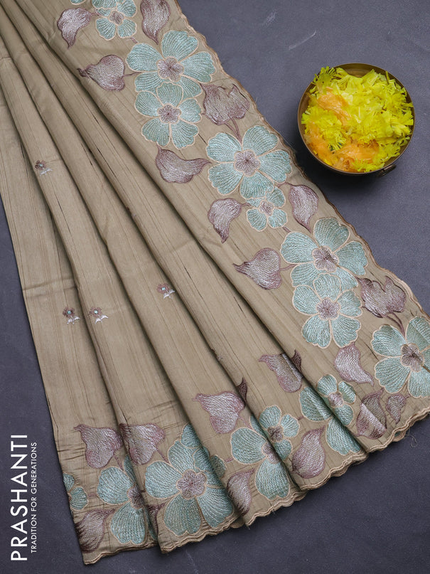 Semi raw silk saree beige with embroidery buttas and floral embroidery border