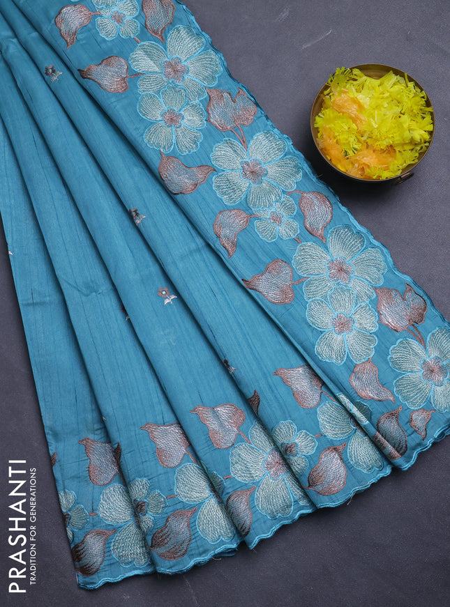 Semi raw silk saree teal blue with embroidery buttas and floral embroidery border