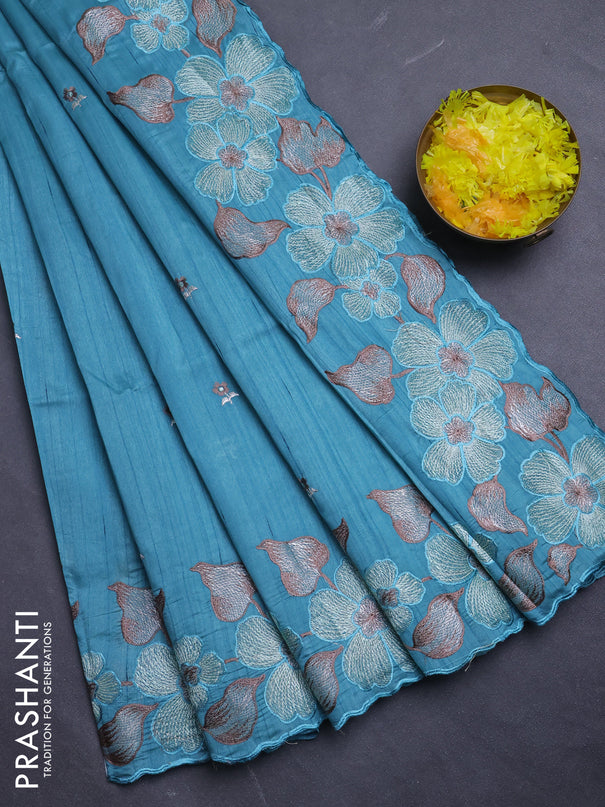 Semi raw silk saree teal blue with embroidery buttas and floral embroidery border
