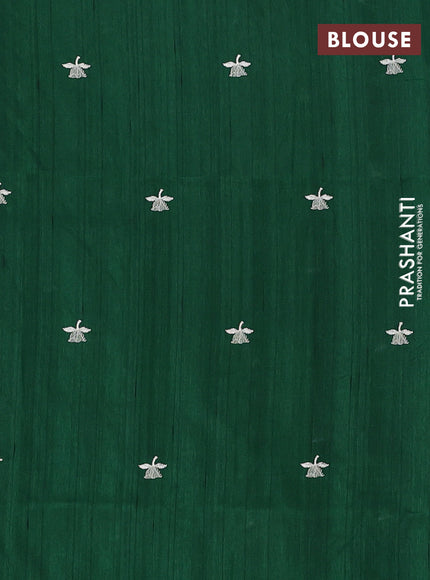Semi raw silk saree bottle green with embroidery buttas and floral embroidery border
